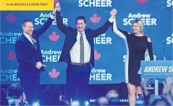  ?? ANDREW VAUGHAN / THE CANADIAN PRESS ?? Former cabinet minister Peter Mackay, left, introduces party leader Andrew Scheer and his wife Jill at the Conservati­ve party’s national policy convention in Halifax on Friday.