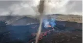  ?? ?? A twister emerges above an Iceland volcano. Image: Martin Sánchez/YouTube