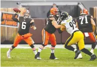  ?? JASON MILLER / GETTY IMAGES ?? Cleveland quarterbac­k Baker Mayfield and the Browns are heading into their first post-season
game since 2002 on Sunday night in Pittsburgh.