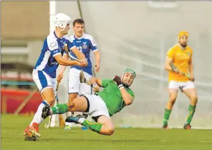  ??  ?? Ireland’s James Barry dives in to block an effort from Scotland’s John MacRae.