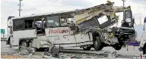  ?? PHOTO: REUTERS ?? The wreckage of a tour bus that crashed into a semi-trailer after being extricated on the freeway near Palm Springs, California.