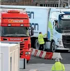  ?? AP ?? Customs officials check vehicles and documents at the P&O ferry terminal at the port of Larne in Northern Ireland.