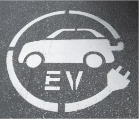  ?? CITIZEN NEWS SERVICE PHOTO BY JONATHAN HAYWARD ?? An electric vehicle charging sign is pictured in Squamish, B.C., in 2016.