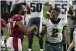  ?? JENNIFER STEWART - THE ASSOCIATED PRESS ?? Eagles quarterbac­k Jalen Hurts, left, and Arizona wide receiver Larry Fitzgerald shake hands after last Sunday’s game.