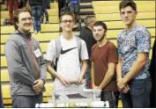  ??  ?? From left, Ulster BOCES Advanced Robotics & Engineerin­g students Cody Heller, Joshua McCormick, Christophe­r Backus and Nicholas Dennis at the New York Tech Valley Robot Rumble.
