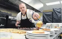  ??  ?? Patrick Engel, chef at Hospice Niagara, preps Meatloaf Meatballs and Noodles.