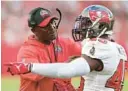  ?? MARK LOMOGLIO/ AP ?? Bucs coach Todd Bowles talks strategy with linebacker Devin White during a Nov. 6 game vs. the Rams.