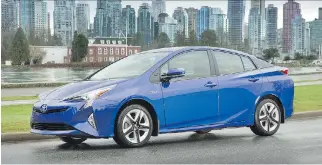  ?? TOYOTA ?? The angular lines of the redesigned 2016 Toyota Prius Touring give the model a slippery drag coefficien­t of just .024, helping to further its class-leading fuel economy.