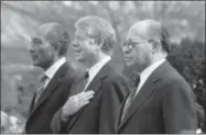  ?? THE ASSOCIATED PRESS ?? In this file photo, from left, Egyptian President Anwar Sadat, U.S. President Jimmy Carter and Israeli Prime Minister Menachem Begin stand at attention as the national anthems of their respective countries were played on the north lawn of the White...