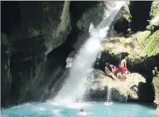 ?? RENE BRUEMMER ?? Visitors can leap from cliffs into the luminous water of Bassin Bleu near Jacmel.