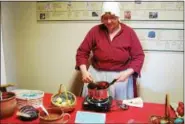  ?? LISA MITCHELL - DIGITAL FIRST MEDIA ?? Visitors to Daniel Boone Homestead in Birdsboro learned about the Easter Hare and natural materials used to dye eggs at A Homestead Easter hosted March 31. Pictured, District Township resident Anne Goda, on the board of the Friends of Daniel Boone...