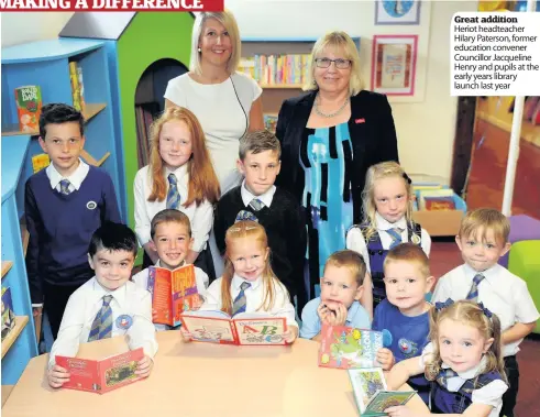  ??  ?? Great addition Heriot headteache­r Hilary Paterson, former education convener Councillor Jacqueline Henry and pupils at the early years library launch last year