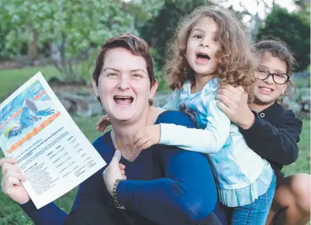  ?? Picture: RICHARD GOSLING ?? Nicole Phillips and children Noor Algassab, 10, and Aisha Algassab, 3, with their Games tickets confirmati­on.