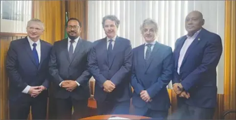  ??  ?? Repsol Director (Global New Ventures) Mikel Erquiaga (second, from right) and a team from the company with Minister of Natural Resources Raphael Trotman (at right), whom they met last month. During the meeting, they are reported to have reiterated...