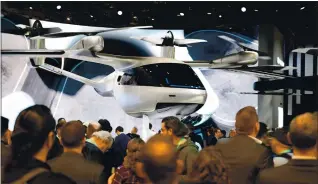  ?? ROBYN BECK — AFP VIA GETTY IMAGES ?? The Hyundai S-A1 electric Urban Air Mobility concept is displayed in January at the 2020 Consumer Electronic­s Show. The flying taxi is designed for Uber Elevate’s upcoming urban air travel service.