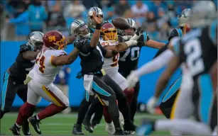  ?? Washington Post photo ?? Former Patriots quarterbac­k Cam Newton threw for 189 yards and two touchdowns and ran for a score in Carolina’s 27-21 home defeat to Washington.