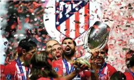  ?? Photograph: Lukas Schulze/Uefa via Getty Images ?? Diego Costa lifts the trophy after his two goals helped Atlético Madrid to win the Super Cup.