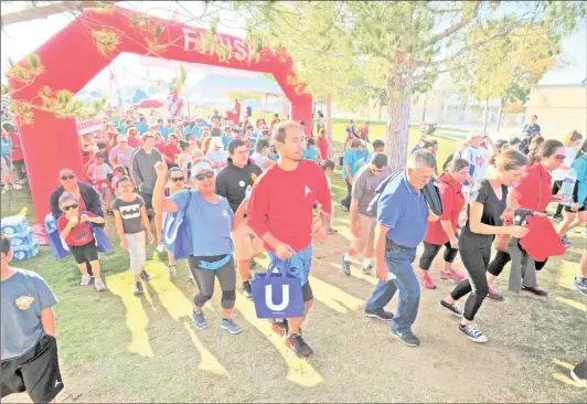  ?? Signal file photo ?? Some of the more than 1,000 attendees walk through the inflated starting line as they begin the walk at the annual American Heart Associatio­n Heart Walk held at Bridgeport Park in Valencia in 2016. This year’s event will celebrate 25 years and will take place on Nov. 3 from 7:30 to 11 a.m. at Bridgeport Park.