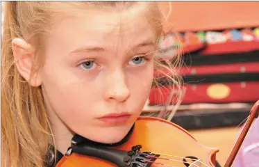  ?? Photo by Declan Malone ?? Caoimhe Ní Dhubháin, Ballyferri­ter, was a picture of concentrat­ion at one of Máire Breathnach’s fiddle classes during Scoil Cheoil an Earraigh.