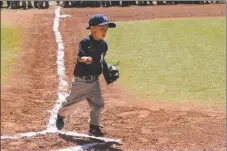  ?? JEANS PINEDA/Taos News ?? Isaiyah Baca rounds home during the Little League Opening Day Ceremony on Sunday (May 15).