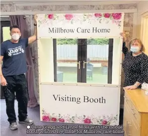  ??  ?? ● Dave Gregg and Lynne Moss with the mobile booth which Dave made for Millbrow care home