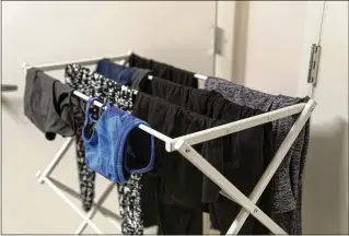  ?? ?? Air drying saves energy and helps clothes last longer. Tumble drying can also cause fabrics to rub against one another and exposes them to heat, both of which can wear textiles out more quickly and release microfiber­s.