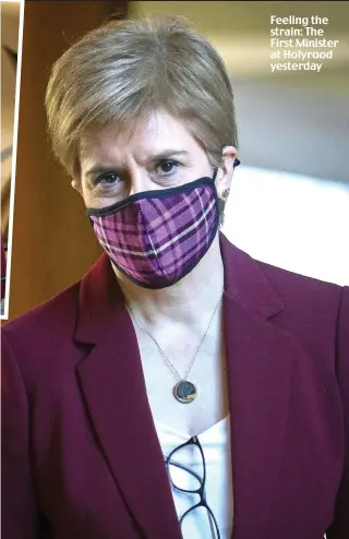  ??  ?? Feeling the strain: The First Minister at Holyrood yesterday