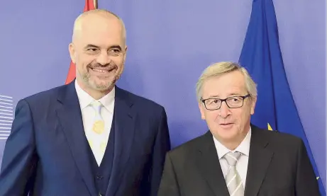  ??  ?? Commission chief Jean-Claude Juncker (r) with Edi Rama. ‘It is not generosity from the Greek side to support Albania’s EU integratio­n; it’s in Greece’s interest,’ says Rama.