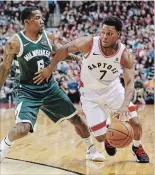  ?? RICK MADONIK TORONTO STAR ?? Raptors guard Kyle Lowry tries to drive around Milwaukee Bucks guard Eric Bledsoe in Toronto on Sunday. Lowry didn’t have a point in the Raptors’ 104-99 loss.