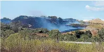  ?? PHOTO: TOMMY LIVINGSTON/FAIRFAX NZ ?? The grass fire on the way to Waimarama Beach, which has stretched firefighte­rs and claimed at least one house.