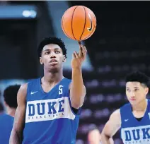  ?? NATHAN DENETTE/THE CANADIAN PRESS ?? Canadian basketball star R.J. Barrett practises with his Duke Blue Devils teammates in Mississaug­a, Ont., on Tuesday. Barrett is the No. 1 recruit in North America in 2018.