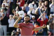  ?? RYAN KANG — THE ASSOCIATED PRESS ?? Jon Rahm celebrates on the 18th green after winning the Genesis Invitation­al golf tournament at Riviera Country Club on Sunday, in the Pacific Palisades area of Los Angeles.