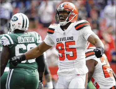  ?? JOE ROBBINS / GETTY IMAGES ?? Cleveland’s Myles Garrett celebrates a play in the game against the New York Jets on Sunday. Garrett recorded two sacks and two run stops in the Browns’ 17-14 loss.