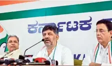  ?? ?? Chief Minister Siddaramai­ah, KPCC president D.K. Shivakumar, and AICC general secretary Randeep Singh Surjewala at a press conference in Bengaluru on Friday.