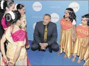  ?? MARCUS INGRAM / GETTY IMAGES FOR UNICEF ?? Laurence Fishburne, shown with members of the Bharathaka­la Dance Academy during the UNICEF gala held earlier this year, is back for “Ant-Man and the Wasp.”