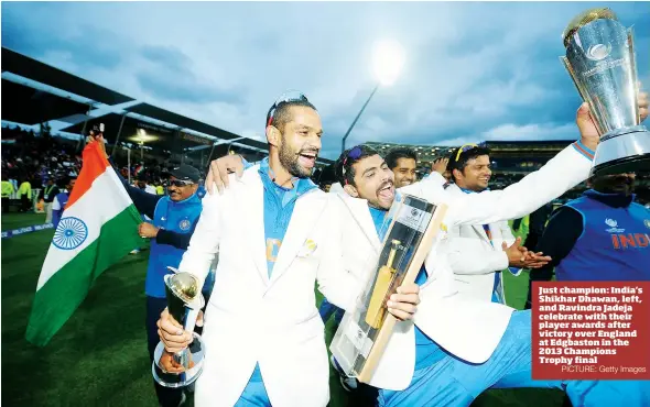  ?? PICTURE: Getty Images ?? Just champion: India’s Shikhar Dhawan, left, and Ravindra Jadeja celebrate with their player awards after victory over England at Edgbaston in the 2013 Champions Trophy final