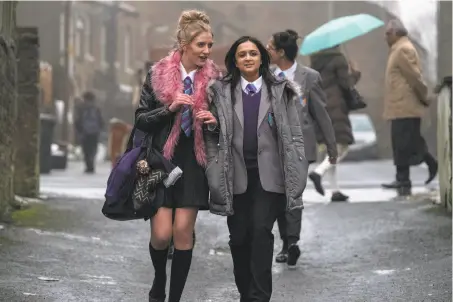  ?? Acorn TV ?? Poppy Lee Friar (left) as class bad girl and Amy-Leigh Hickman as her Asian friend soon have a falling out in “Ackley Bridge.”