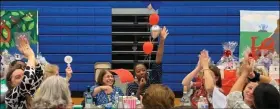  ?? PHOTO COURTESY OF HOLY CROSS HOME & SCHOOL ASSOCIATIO­N ?? Guests celebrated raffle wins at the Holy Cross Regional Catholic School at the annual Basket Raffle held at Pope John Paul II High School.