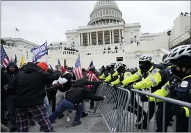  ?? THE ASSOCIATED PRESS FILE PHOTO ?? Trump supporters try to break through a police barrier at the Capitol in Washington. Right-wing extremism has previously mostly played out in isolated pockets of America or in smaller cities.