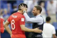  ?? MATTHIAS SCHRADER — THE ASSOCIATED PRESS ?? England head coach Gareth Southgate, right, celebrates victory of his team over Sweden with England’s Harry Maguire during the quarterfin­al match between Sweden and England at the 2018 soccer World Cup in the Samara Arena, in Samara, Russia, Saturday.