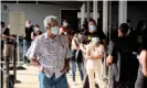  ?? Photograph: Theo Rouby/AFP/Getty Images ?? Residents wait to vote for the referendum on independen­ce outside a polling station of the City Hall in Noumea.