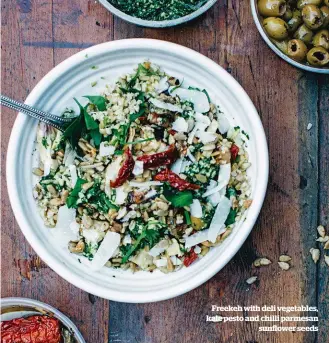  ??  ?? Freekeh with deli vegetables, kale pesto and chilli parmesan sunflower seeds