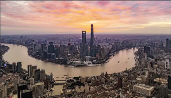  ?? XINHUA ?? Aerial photo shows the morning view of the Lujiazui area in Pudong, eastern Shanghai.