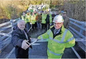  ??  ?? Opening Councillor Ian Miller and David Graham, a contracts manager with Morgan Sindall