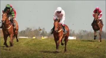  ??  ?? Jockey Shane O’Rourke (centre) guiding Crack Du Ninian to victory at Courtown on Sunday.