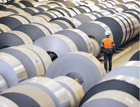  ?? JEAN-CHRISTOPHE VERHAEGEN/AFP/GETTY IMAGES ?? Coils of steel are stored in steel giant ArcelorMit­tal’s plant in Florange, France. Canadian steel firms like ArcelorMit­tal Dofasco, a unit of ArcelorMit­tal, have seen few signs of whether the U.S. will grant them an exemption extension for tariffs.