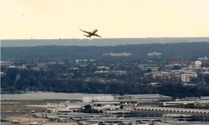  ?? ?? A passenger aircraft takes off from Arlington, Virginia. Airlines warned 5G plans could ground planes. Photograph: Stefani Reynolds/AFP/ Getty Images