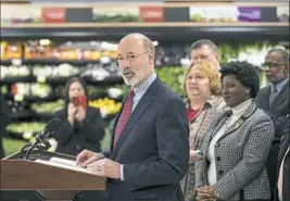  ?? Matt Rourke/Associated Press ?? Gov. Tom Wolf speaks at a news conference Wednesday at The Fresh Grocer in Philadelph­ia.