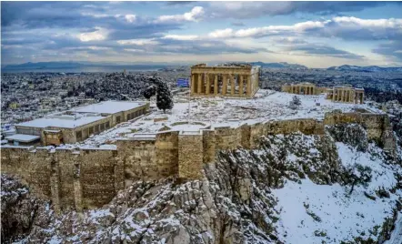 ??  ?? No visitors for now: The ancient Acropolis hill, a popular tourist spot in Athens, Greece. The country has eased restrictio­ns for vaccinated Israelis and is discussing a similar arrangemen­t with the UK. — AP
