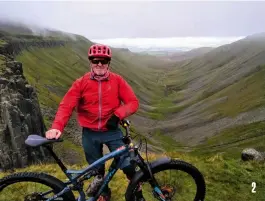  ?? ?? 2. Trevor Willans standing proudly at the top of High Cup Nick in the Pennines